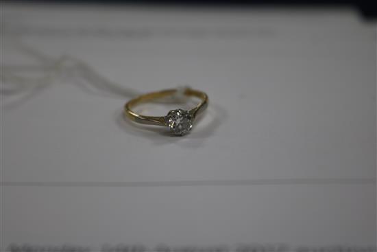 An 18ct gold and platinum solitaire diamond ring,